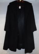 A mid-20th Century black astrakan coat