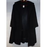 A mid-20th Century black astrakan coat