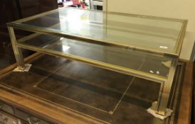 A modern Pierre Vandel of Paris brass framed bevel glazed two tier coffee table