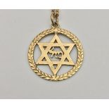 A 9 carat gold Star of David pendant, set on a 9 carat gold chain, approx 7.