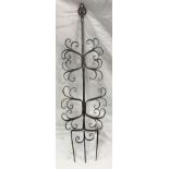 A steel toasting fork with scrollwork decoration in the manner of Gimson