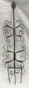 A steel toasting fork with scrollwork decoration in the manner of Gimson