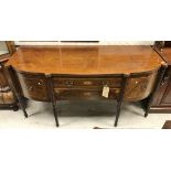 A late Regency mahogany bow-fronted sideboard with two central drawers flanked by cupboard door and