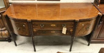 A late Regency mahogany bow-fronted sideboard with two central drawers flanked by cupboard door and