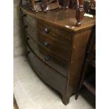 A late Regency mahogany bow fronted chest of four long drawers
