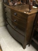 A late Regency mahogany bow fronted chest of four long drawers