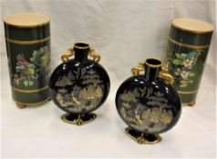 A pair of circa 1900 green glazed enamal decorated cylindrical vases decorated with birds amongst