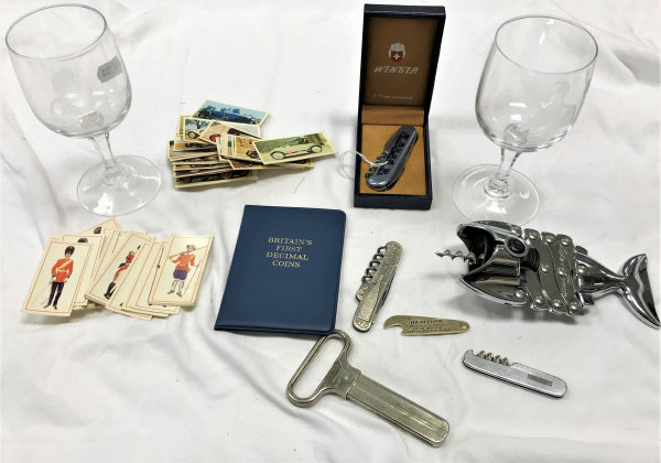 A Wenger penknife, a collection of corkscrews and bottle openers,