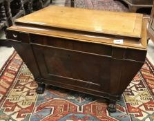 A 19th Century Irish mahogany wine cooler of sarcophagus form,