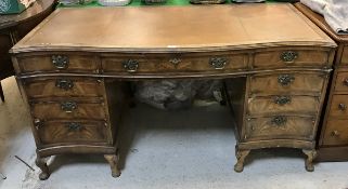 A burr walnut veneered double pedestal desk in the Georgian style,