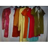 A collection of vintage 1960's clothing, mainly Sizes 8-10, comprising an orange suede dress,