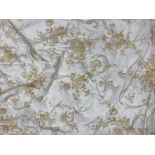 Two pairs of cotton yellow and cream cherub and foliate interlined curtains with fixed triple pinch