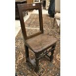 An 18th Century oak back stool,