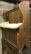 A modern pine tavern type wing sided hall settle