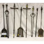 A collection of eight 18th/19th Century steel fire irons
