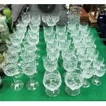 A suite of Webbs Normandy pattern cut glassware including nineteen tall wines, ten red wines,