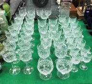 A suite of Webbs Normandy pattern cut glassware including nineteen tall wines, ten red wines,