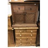 A modern stained pine cabinet with two drawers over two cupboard doors and a pine chest of two