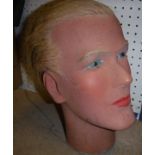 A vintage male mannequin head