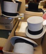 Four various grey top hats, together with three further hats to include stetson,