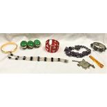 A box of assorted costume jewellery to include various wristwatches,