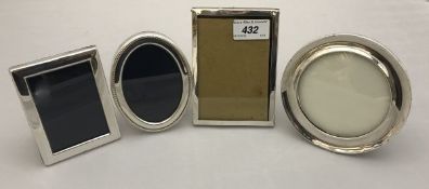 A collection of two early 20th Century photograph frames, one rectangular, one circular,