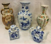 A modern Chinese blue and white baluster shaped vase, tea caddy, disc teapot,