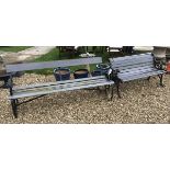 A modern cast iron and slatted wooden garden bench seat,