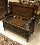 A carved oak monk's bench