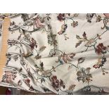 Two pairs of linen type beige ground multi-coloured foliate decorated lined curtains with fixed
