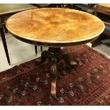 A Victorian walnut centre table, the burr quartered top with moulded edge,