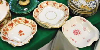 A collection of early 19th Century Derby dinner wares including four blue and yellow and green