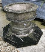 A Haddonstone font of octagonal form in the Gothic Revival style,