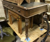 A Victorian mahogany two drawer writing table