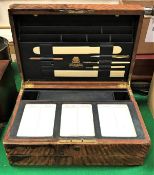 A Victorian leather covered writing slope by Toulmin & Gale of London with well fitted interior and