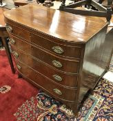 A Georgian mahogany bow-fronted chest of four long graduated drawers