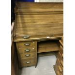 A circa 1900 oak roll top desk