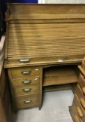 A circa 1900 oak roll top desk