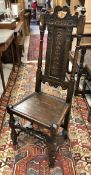 An oak panel seated chair in the 17th Century manner,