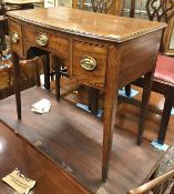A 19th Century mahogany bow-fronted side table with three frieze drawers on square tapered legs