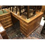 A modern mahogany double pedestal desk and near matching filing cabinet