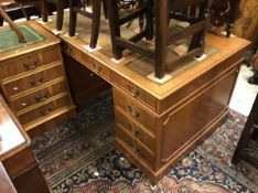 A modern mahogany double pedestal desk and near matching filing cabinet