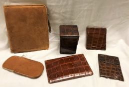 A vintage crocodile skin covered card case, three various crocodile wallets,