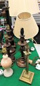 A black lacquered and brass column table lamp, a corinthian column brass table lamp,