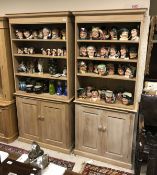 A matched pair of limed oak bookcase cabinets,