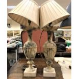 A pair of 19th Century alabaster urn shaped table lamps with foliate castellated rims