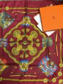 A Hermes scarf in box, together with a straw hat with floral decoration,