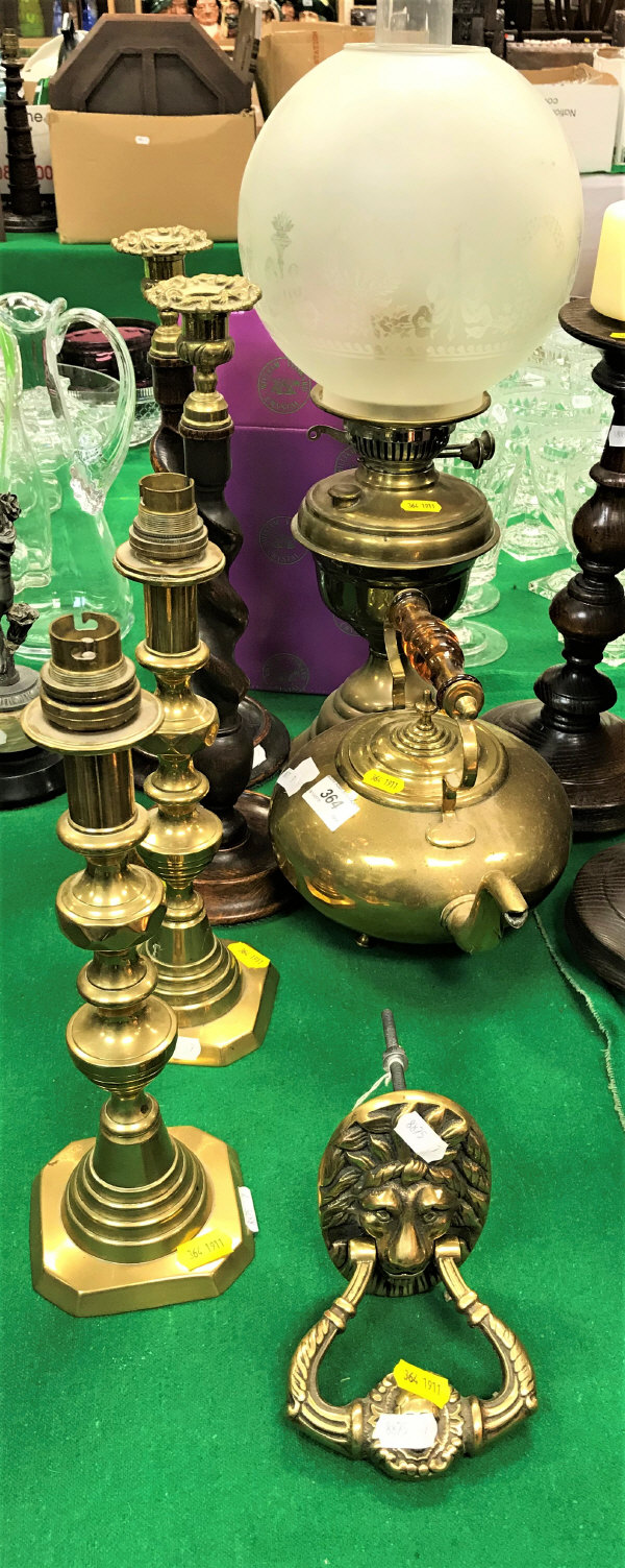 A pair of Victorian brass candle sticks converted to electricity,