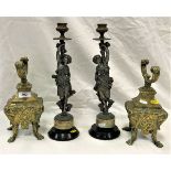 A pair of 19th Century Continental brass chenets in the Rococo style together with a pair of
