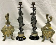 A pair of 19th Century Continental brass chenets in the Rococo style together with a pair of